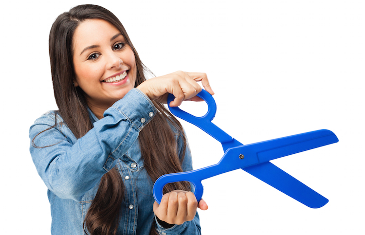 happy young woman with scissors